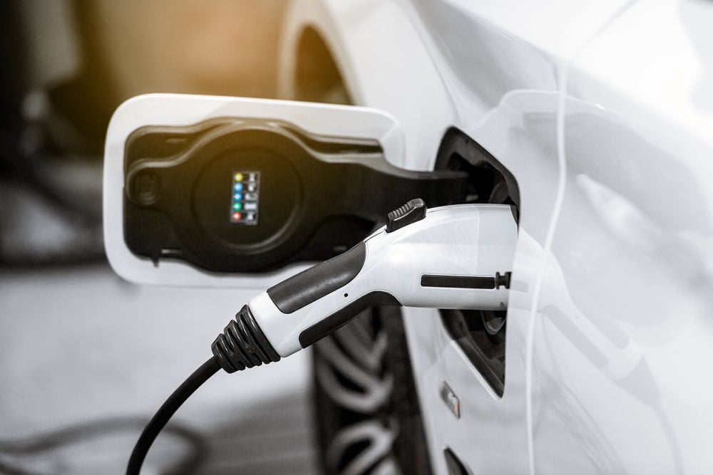 white-ev-plugged-in white-ev-plugged-in